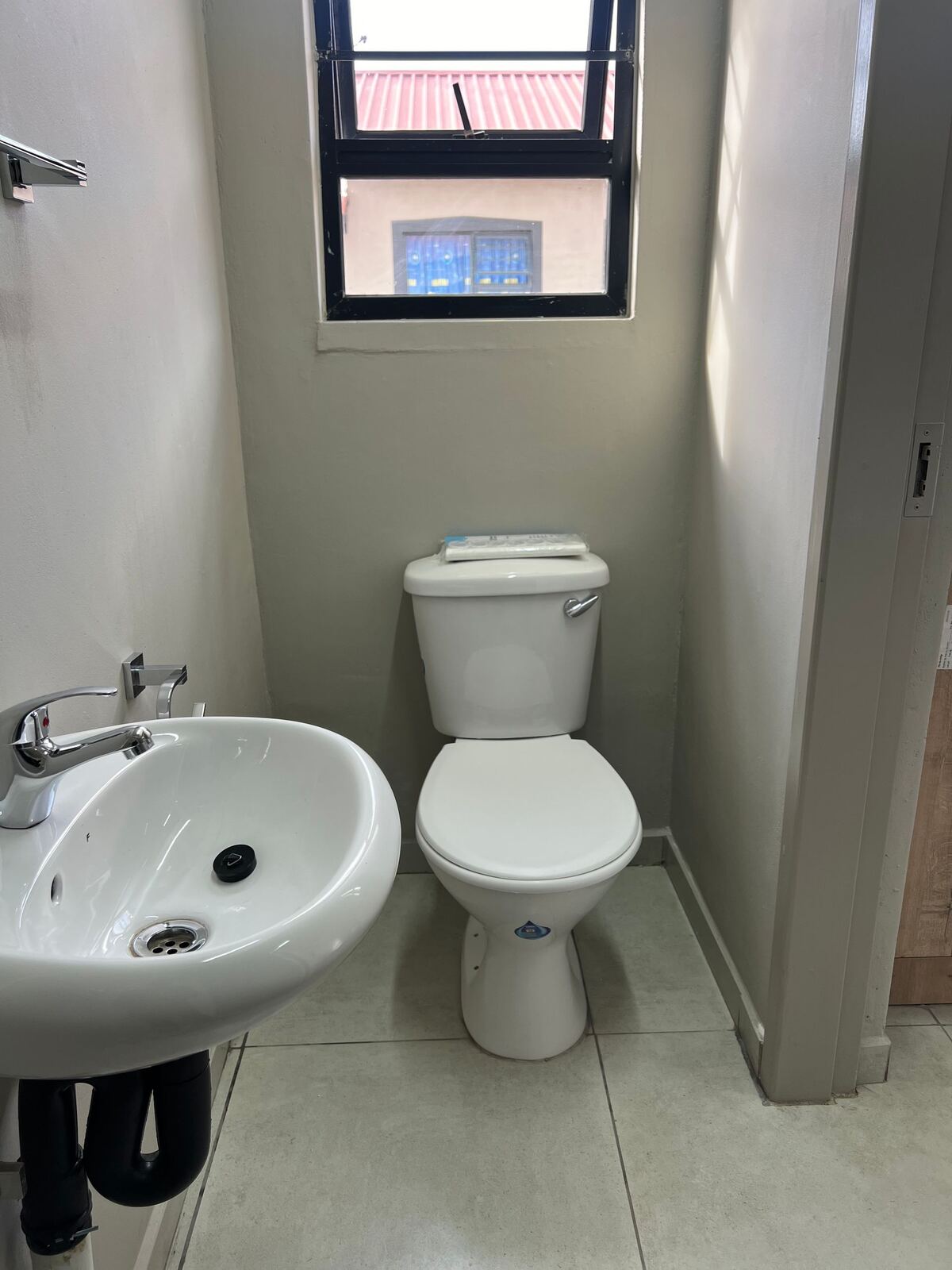 Bathroom with basin and toilet