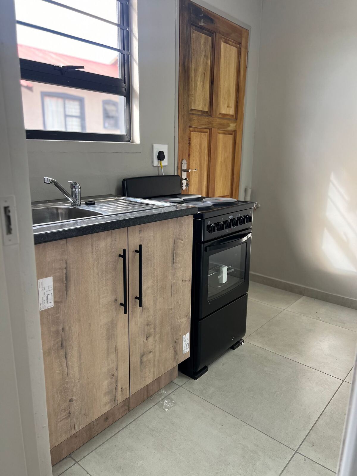 Kitchen corner with stove and window