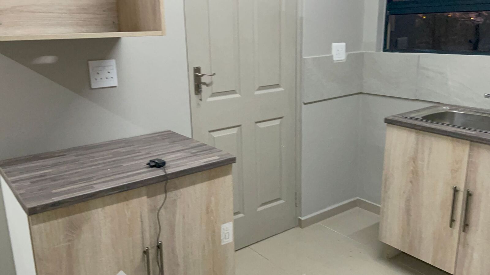 Kitchen counter with wood-finish cupboards